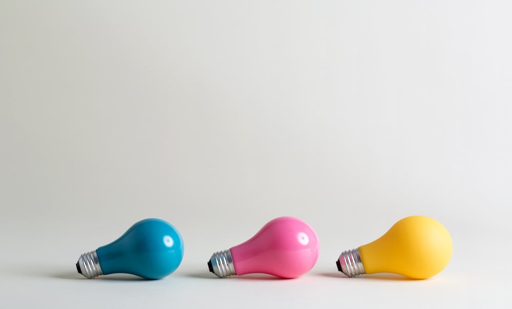 Colorful light bulbs on a white background